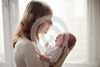 Young mother with crying baby Stock Photo