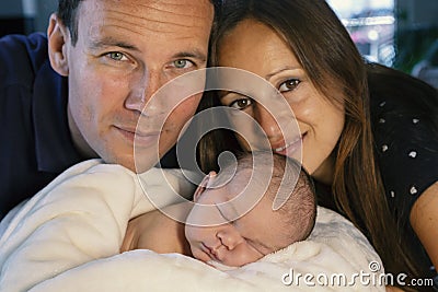 Young family with newborn Stock Photo