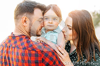 Young mother and father with their cute daughter Stock Photo