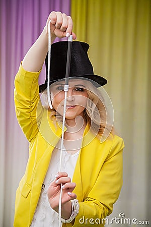 Woman magician shows tricks Stock Photo