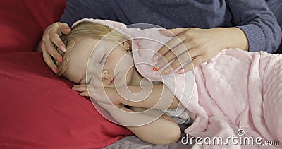 Cute baby sleeping on the bed at home. Little girl sleeping in morning light Stock Photo