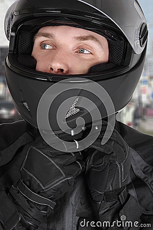 Young motorcyclist man wearing helmet Stock Photo