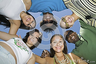 Young Multiethnic Friends Forming A Circle Stock Photo