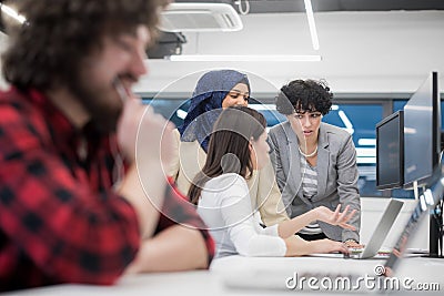 Young multiethnics team of software developers working together Stock Photo