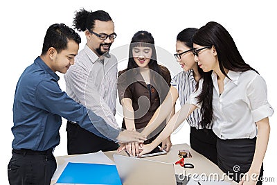 Young multiracial business team joining hands Stock Photo