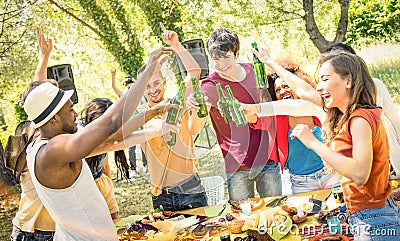 Young multiracial friends toasting beer at barbecue garden party Stock Photo