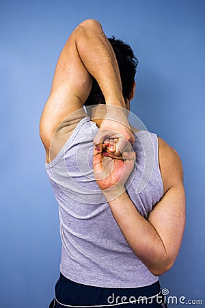 Man stretching arms behind his back Stock Photo
