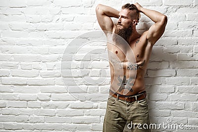 Young muscular bearded white man half naked Stock Photo