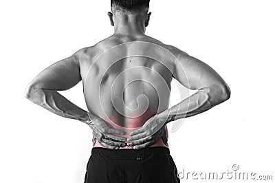 Young muscular body sport man holding sore low back waist are suffering pain in athlete stress Stock Photo