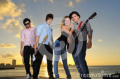 Young musical band posing outdoors Stock Photo