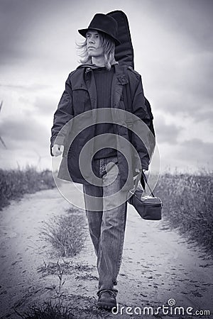 Young musician walking Stock Photo