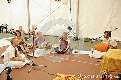 Young musicians playing Indian musical instruments for meditation, group of people listening Editorial Stock Photo