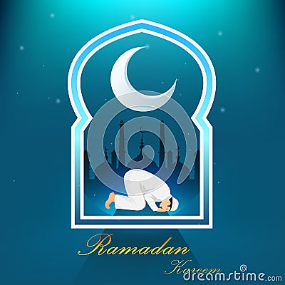 Young muslim man praying on blue background Stock Photo