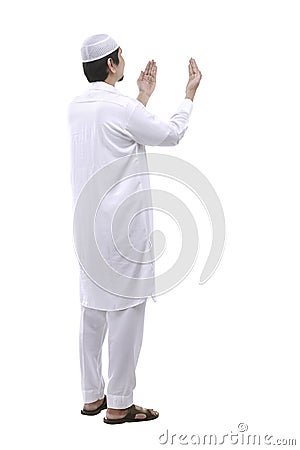 Young muslim man praying Stock Photo