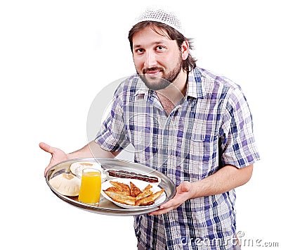 Young muslim man with prepared food Stock Photo