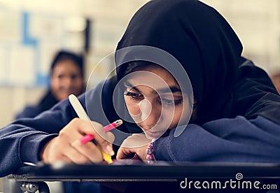 Young Muslim student studying at school Stock Photo