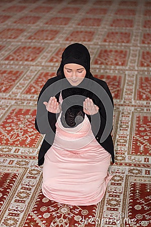 Young muslim woman praying Stock Photo
