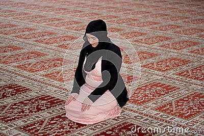 Young muslim woman praying Stock Photo