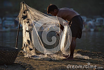 Young Myanmar fisherman Editorial Stock Photo