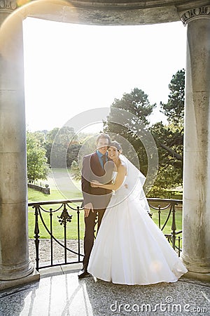 Young Newlywed Couple Embracing Stock Photo