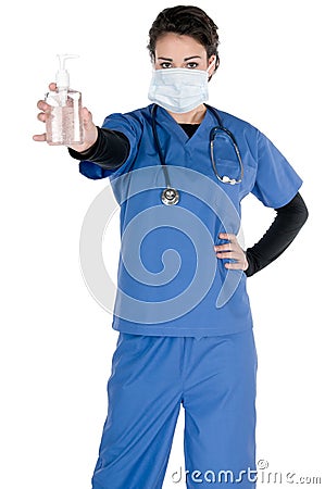 Young nurse, blue scrubs, mask, hand sanitizer Stock Photo