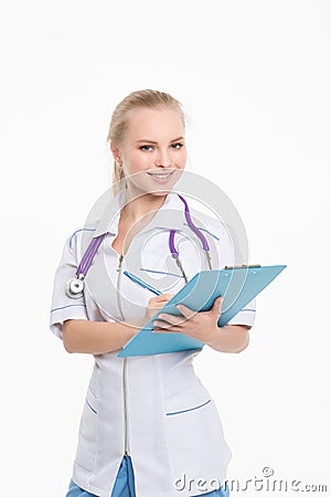 Young nurse fills out a medical card Stock Photo