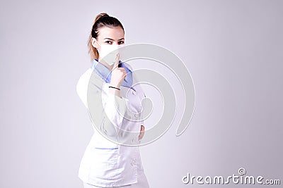 Young nurse gesture silence please Stock Photo