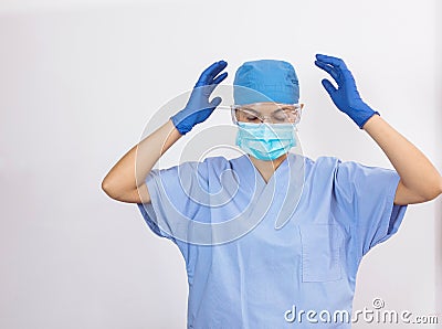 Young nurse in medical blue equipment exclaiming emotion Stock Photo