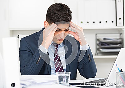 Young office manager is having complicated issue in project Stock Photo