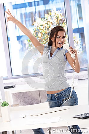 Young office worker having fun in office Stock Photo