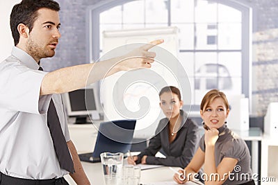 Young office worker leading business training Stock Photo
