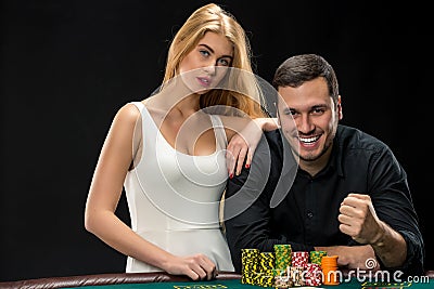 Young Ñouple playing poker and have good time in casino Stock Photo