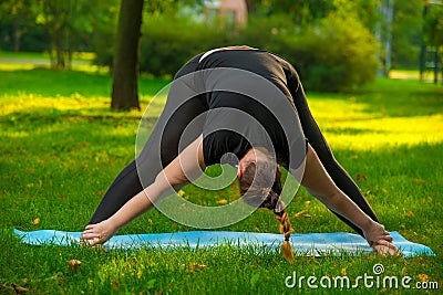 young oversized woman doing stretching exercises Stock Photo