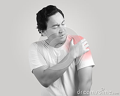 Young Pain Having Shoulder Pain Stock Photo
