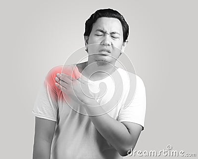 Young Pain Having Shoulder Pain Stock Photo