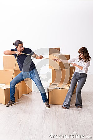 Young pair and many boxes in divorce settlement concept Stock Photo
