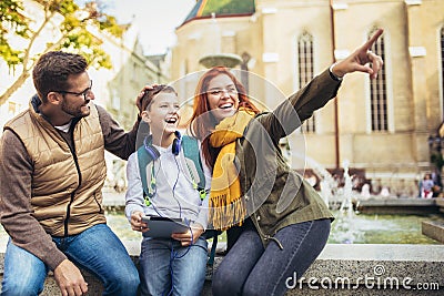 Parents taking their little child to school Stock Photo