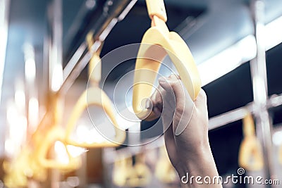 Young passenger man hand holding handrail in subway. Stock Photo