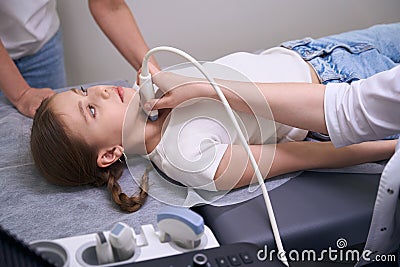 Young patient in a clinic for ultrasound of thyroid gland Stock Photo