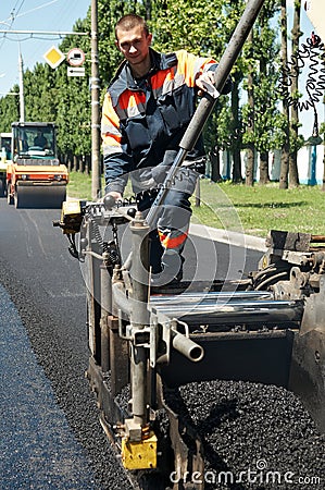 Young paver worker at asphalting Stock Photo