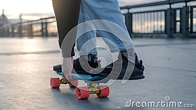 Fragment of a penny board and legs close-up. Stock Photo