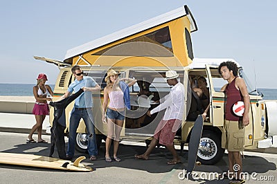 Young People By Campervan Stock Photo