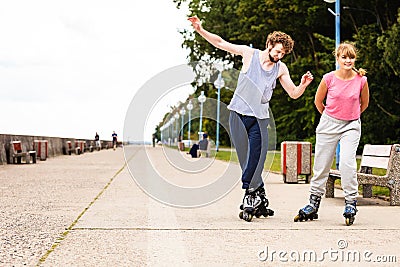 Young people casually rollblading together. Stock Photo