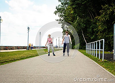 Young people casually rollblading together. Stock Photo