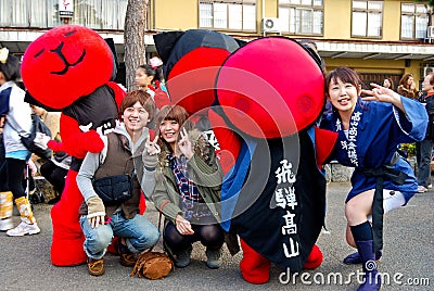 Young people celebrating a sake festival in the old town of Hida Takayama, Japan Editorial Stock Photo