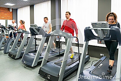 Young people doing exercises in the gym Editorial Stock Photo