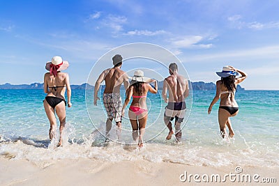 Young People Group On Beach Summer Vacation, Friends In Water Seaside Stock Photo