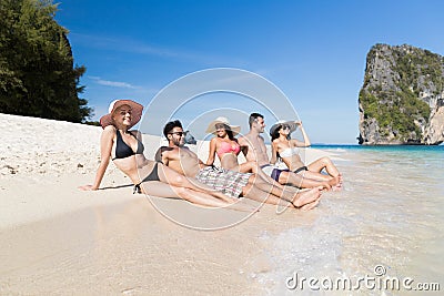 Young People Group On Beach Summer Vacation, Happy Smiling Friends Lying Sand Seaside Stock Photo