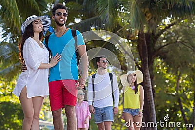 Young People Group Tropical Park Palm Trees Friends Walking Speaking Holiday Summer Vacation Stock Photo