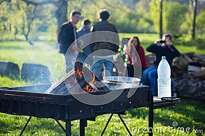 Young people having barbecue out in the garden Editorial Stock Photo